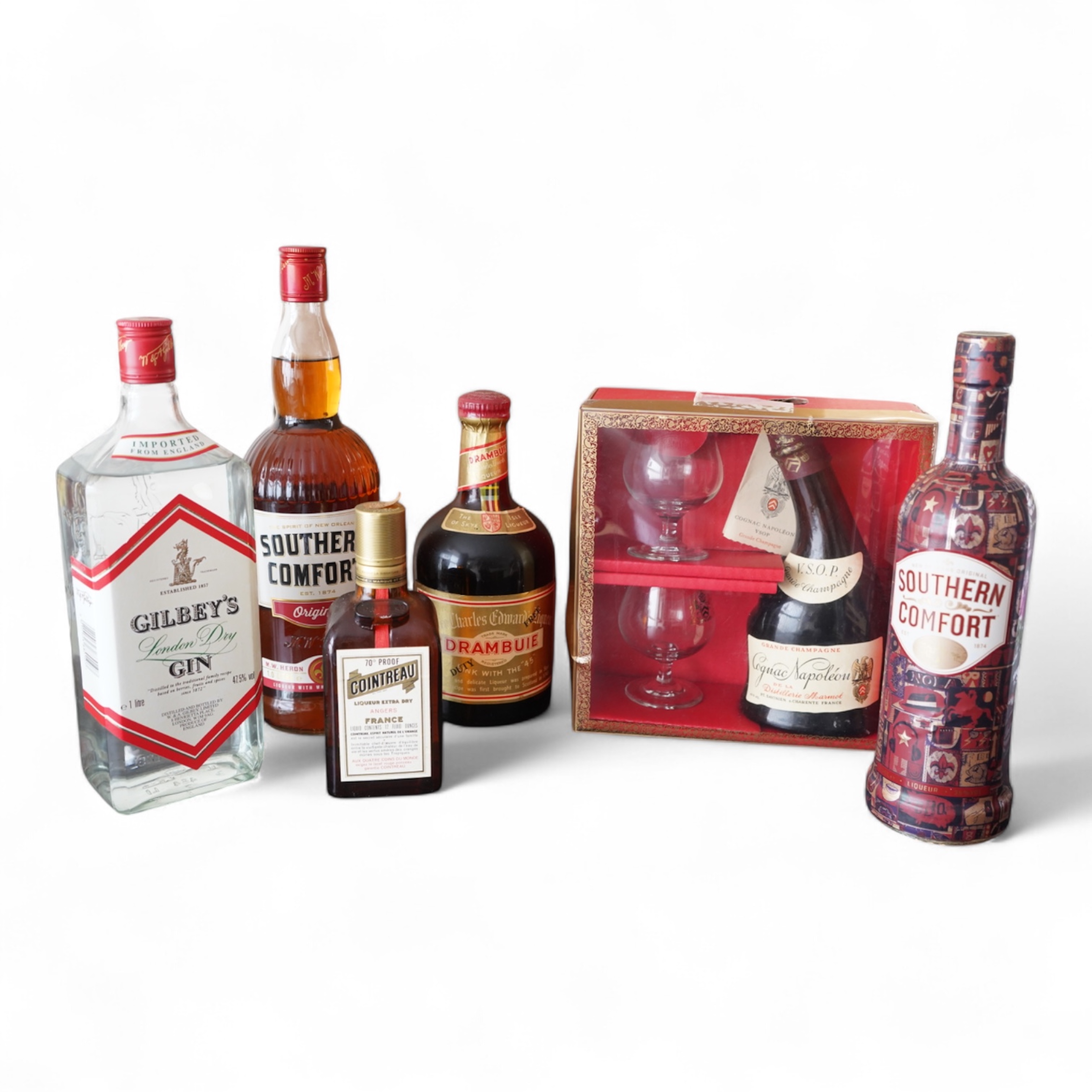 Six bottles of spirits and liqueurs, including whiskey and gin